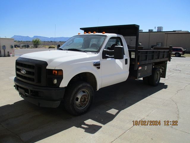 IMG_0139- Photo of a white flatbed dump truck available for auction