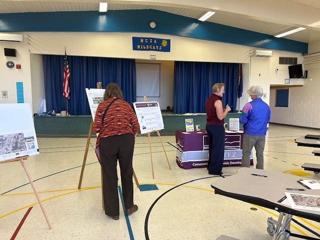 Photo of Helen West talking with residents about the Safe Routes to School funding at Mesa Elementar